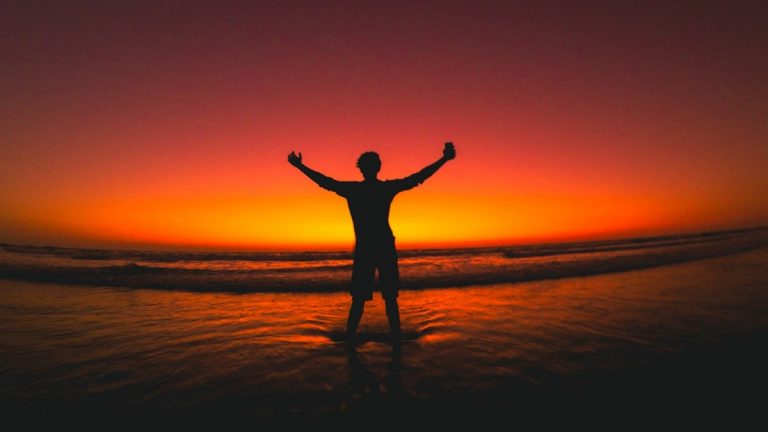 silhouette photography of man at beach